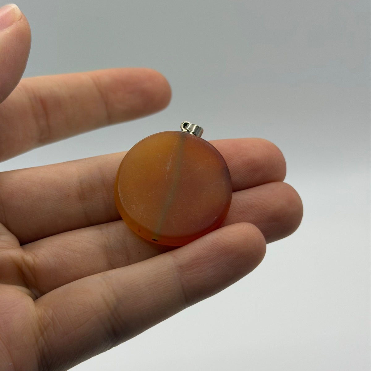 Vintage Carved Carnelian Agate Disc Pendant – Hand Engraved Archer Zodiac Figure